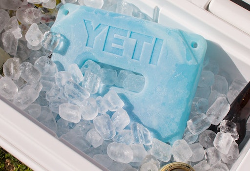 https://yeti-web.imgix.net/25fc950ef1d1a686/original/YETI_Ice_Cooler_Accessories_Product_overview_Image_Lifestyle-1x.jpg?auto=format&fit=crop&w=512&h=350