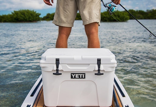 https://yeti-web.imgix.net/32c5e716dafc0f33/original/Tundra_35_Hard_Cooler_Product_Overview_Image_Lifestyle-1x.jpg?auto=format&fit=crop&w=512&h=350